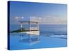 Gazebo Reflecting on Pool with Sea in Background, Long Island, Bahamas-Kent Foster-Stretched Canvas