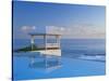 Gazebo Reflecting on Pool with Sea in Background, Long Island, Bahamas-Kent Foster-Stretched Canvas