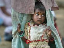 A Displaced Tamil Child Hangs to Her Father's Sarong-Gemunu Amarasinghe-Premium Photographic Print