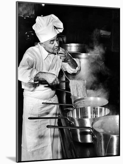 Gene Leone, Taking a Bite Test to Determine Whether the Bo Ling Spaghetti is Properly Firm-Eliot Elisofon-Mounted Photographic Print