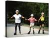 Generations of Women Rollerblading Together-Bill Bachmann-Stretched Canvas