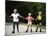 Generations of Women Rollerblading Together-Bill Bachmann-Mounted Photographic Print