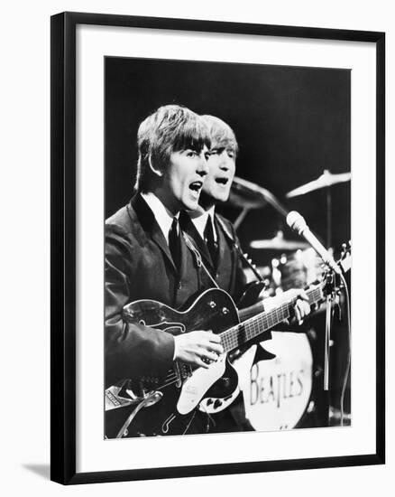 George Harrison (Left) and John Lennon of the Beatles-null-Framed Photo