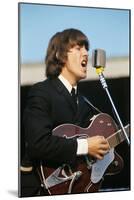 George Harrison Playing Guitar and Singing-null-Mounted Photographic Print