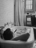 Writer Russell Finch Taking Portable Television Set to Bathroom During His Bath-George Skadding-Photographic Print