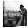 Georges Simenon Smoking the Pipe on a Bridge in Milan-null-Stretched Canvas