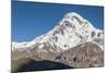 Georgia, Georgian Military Highway, Kazbegi-Stepantsminda. Gergeti Trinity Church and Mt. Kazbek.-Walter Bibikow-Mounted Photographic Print