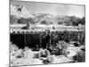 Georgia O'Keeffe Climbing a Ladder Outside Ghost Ranch, Her Desert Home-John Loengard-Mounted Photographic Print