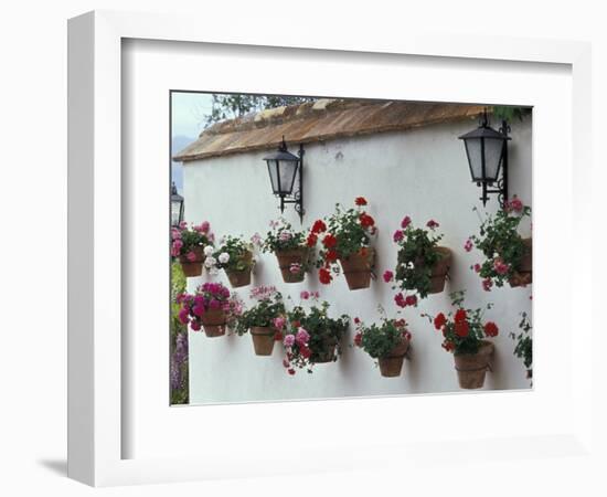 Geraniums along White Wall of Palacio de Mondragon, Ronda, Spain-Merrill Images-Framed Photographic Print