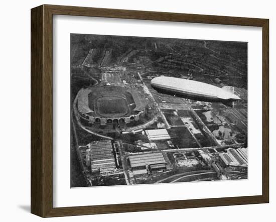 German Airship 'Graf Zeppelin' Flying over Wembley During the Fa Cup Final, London, 1930-null-Framed Giclee Print