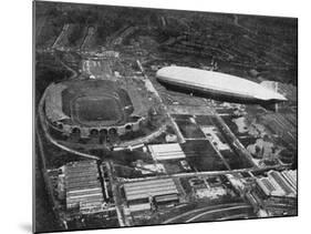 German Airship 'Graf Zeppelin' Flying over Wembley During the Fa Cup Final, London, 1930-null-Mounted Giclee Print