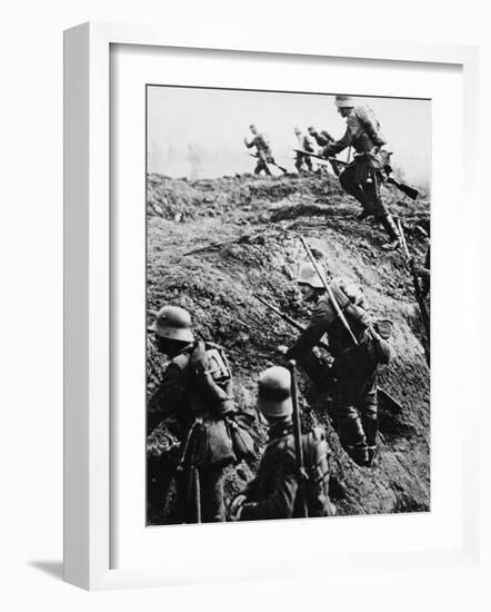 German Soldiers Attacking Out of a Trench During World War I-Robert Hunt-Framed Photographic Print