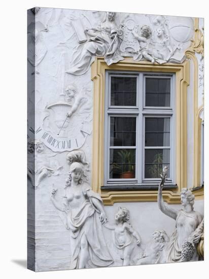 Germany, Bavaria, Munich, Ornate Stucco or Plasterwork Adorning the Front of a House in the City-John Warburton-lee-Stretched Canvas