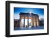 Germany, Berlin. Cyclists Passing under the Brandenburg Gate-Ken Scicluna-Framed Photographic Print