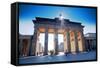 Germany, Berlin. Cyclists Passing under the Brandenburg Gate-Ken Scicluna-Framed Stretched Canvas