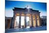 Germany, Berlin. Cyclists Passing under the Brandenburg Gate-Ken Scicluna-Mounted Photographic Print