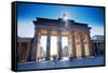 Germany, Berlin. Cyclists Passing under the Brandenburg Gate-Ken Scicluna-Framed Stretched Canvas