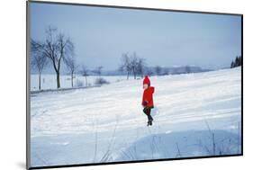 Germany - Bielefeld - 1960's Child Plays in Snow-Richard Baker-Mounted Photographic Print