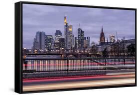 Germany, Hesse, Frankfurt on the Main, Skyline at Dusk, Light Tracks of Passing Cars-Bernd Wittelsbach-Framed Stretched Canvas