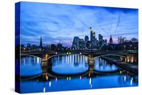 Germany, Hesse, Frankfurt on the Main, Skyline with Ignaz Bubis Bridge at Dusk-Bernd Wittelsbach-Stretched Canvas