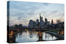 Germany, Hesse, Frankfurt on the Main, Skyline with Ignaz Bubis Bridge at Dusk-Bernd Wittelsbach-Stretched Canvas