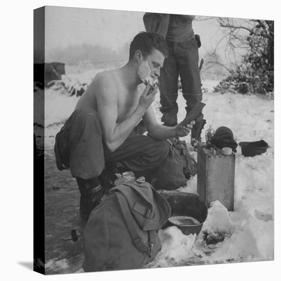 GI shaving with mirror during ull in the Ardennes Forest Conflict called the Battle of the Bulge-John Florea-Stretched Canvas