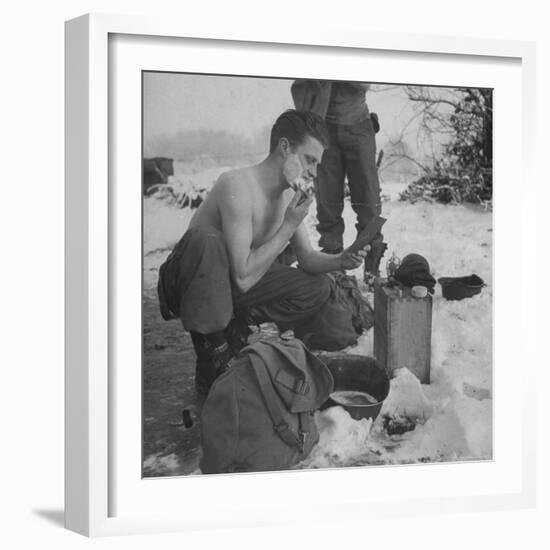 GI shaving with mirror during ull in the Ardennes Forest Conflict called the Battle of the Bulge-John Florea-Framed Photographic Print