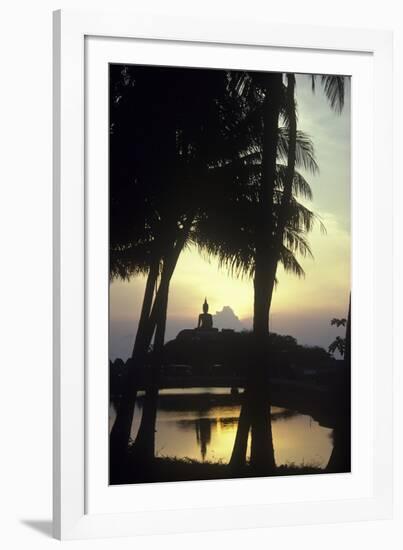 Giant Buddha Statue Seen Through Coconut Palms-null-Framed Photographic Print