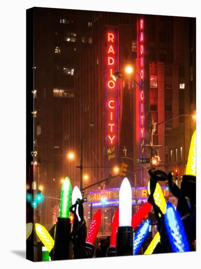 Giant Christmas wreath in front of the Radio City Music Hall on a Winter Night-Philippe Hugonnard-Stretched Canvas