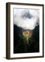 Giant mountain emerging through the clouds in the Himalayas, Nepal on the way to Everest Base Camp-David Chang-Framed Photographic Print