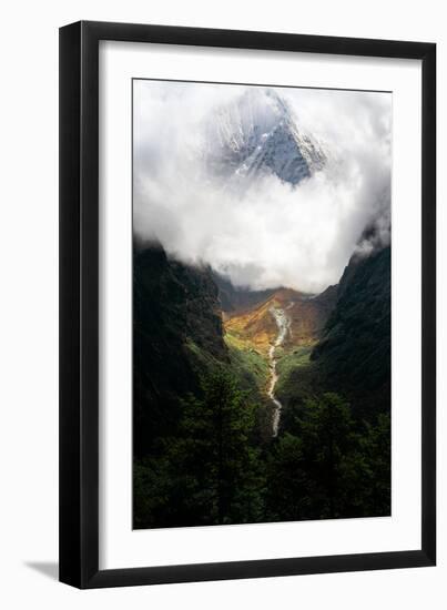 Giant mountain emerging through the clouds in the Himalayas, Nepal on the way to Everest Base Camp-David Chang-Framed Photographic Print