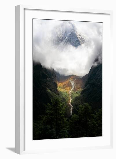 Giant mountain emerging through the clouds in the Himalayas, Nepal on the way to Everest Base Camp-David Chang-Framed Photographic Print