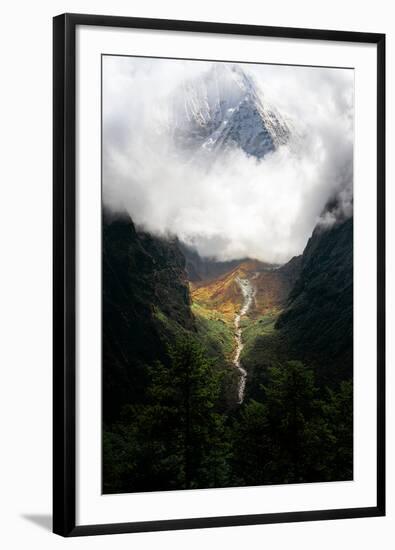 Giant mountain emerging through the clouds in the Himalayas, Nepal on the way to Everest Base Camp-David Chang-Framed Photographic Print