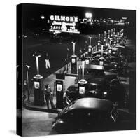 Gilmore Gas Station Featuring Eight Islands, Three Pumps Each, Girl Makes Change Every Two Islands-Allan Grant-Stretched Canvas