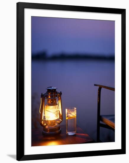 Gin and Tonic by the Light of Hurricane Lamp, Looking Out over the Zambezi River, Zambia-John Warburton-lee-Framed Photographic Print