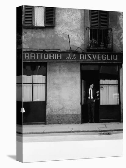 Giorgio Gaber at the Entrance of the Eating House Trattoria Del Risveglio-null-Stretched Canvas