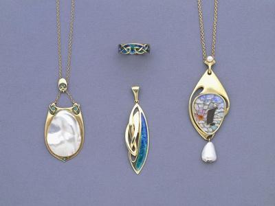 A Group of Liberty and Co Yellow Metal and Enamel Pendants and a Ring Designed by Archibald Knox
