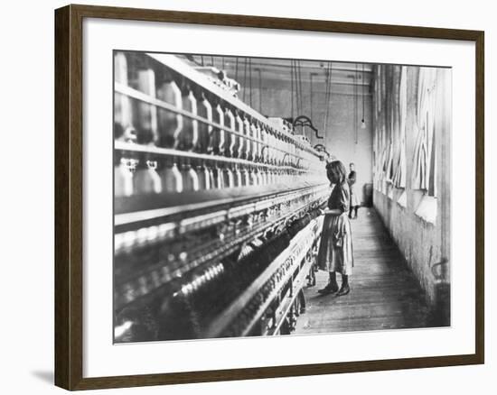 Girl at Spinning Machine-Lewis Wickes Hine-Framed Photographic Print