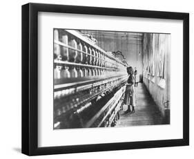 Girl at Spinning Machine-Lewis Wickes Hine-Framed Photographic Print