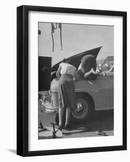 Girl Attendant Looking For Battery For Customer-Allan Grant-Framed Photographic Print