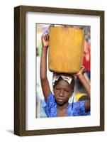 Girl carrying a heavy load, St. Louis, Senegal-Godong-Framed Photographic Print