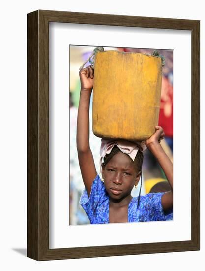 Girl carrying a heavy load, St. Louis, Senegal-Godong-Framed Photographic Print