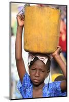 Girl carrying a heavy load, St. Louis, Senegal-Godong-Mounted Photographic Print