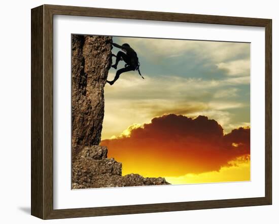 Girl Climbing On The Rock On Sunset Background-Andrushko Galyna-Framed Art Print