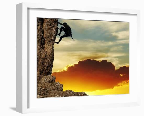 Girl Climbing On The Rock On Sunset Background-Andrushko Galyna-Framed Art Print