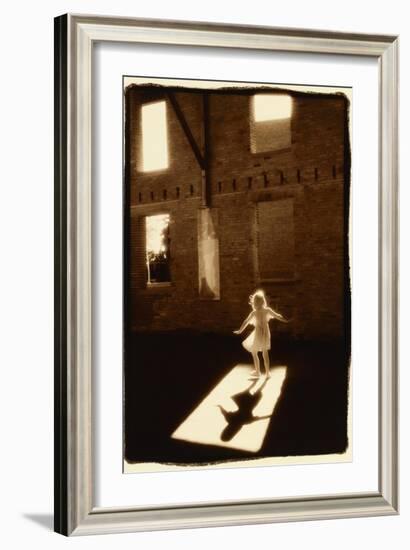 Girl dancing in a shaft of light-Theo Westenberger-Framed Art Print