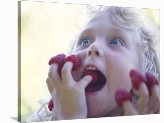 Girl Eating Raspberries, Bellingham, Washington, USA-Steve Satushek-Stretched Canvas