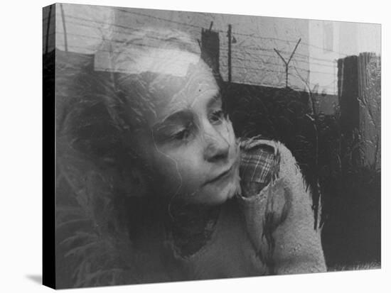 Girl Gazing Pensively Through Pane of Her Apartment Window, Grimly Reflects Image of Berlin Wall-Paul Schutzer-Stretched Canvas