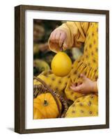 Girl Holding a Baby Pumpkin-Alena Hrbkova-Framed Photographic Print