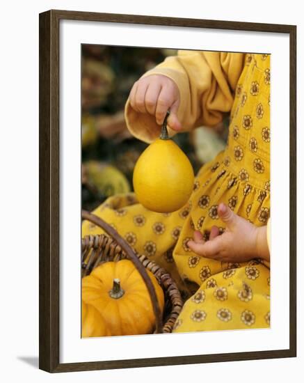 Girl Holding a Baby Pumpkin-Alena Hrbkova-Framed Photographic Print